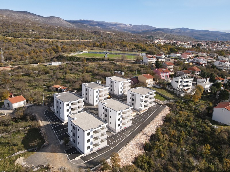Complex with sports ground and mountains