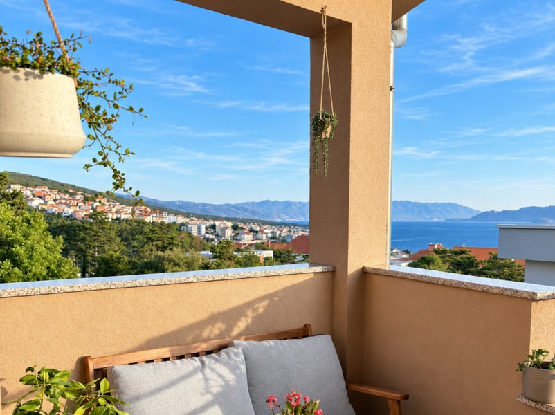 Seating area on the balcony with view over the town
