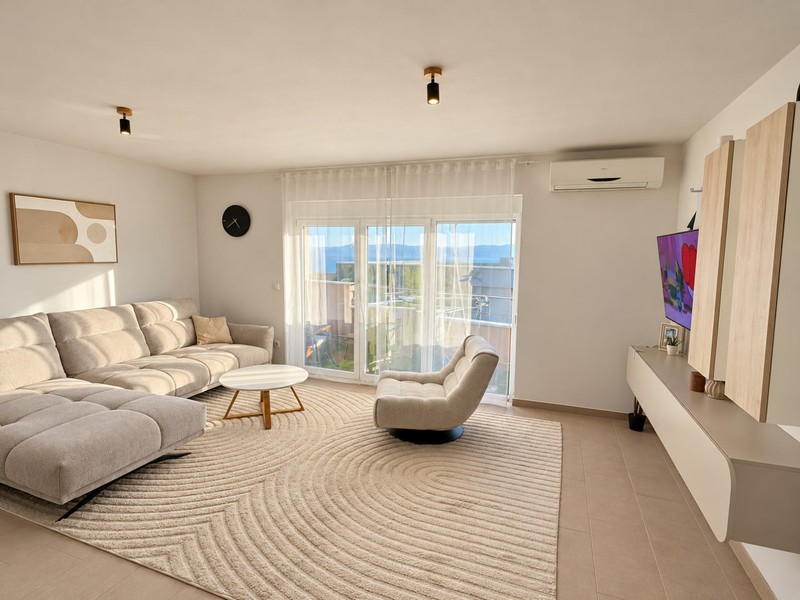 Living room with corner sofa and large window