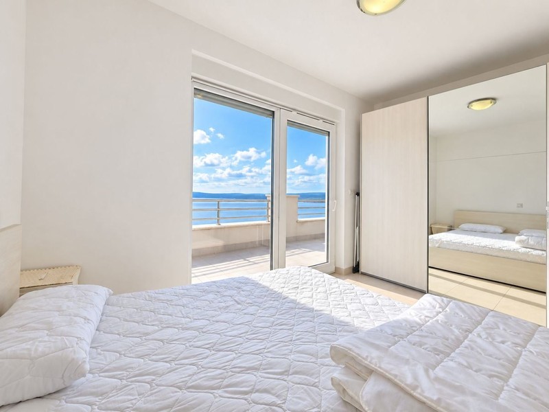 Bedroom with double bed and terrace door