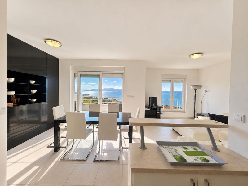 Dining area with large table and windows