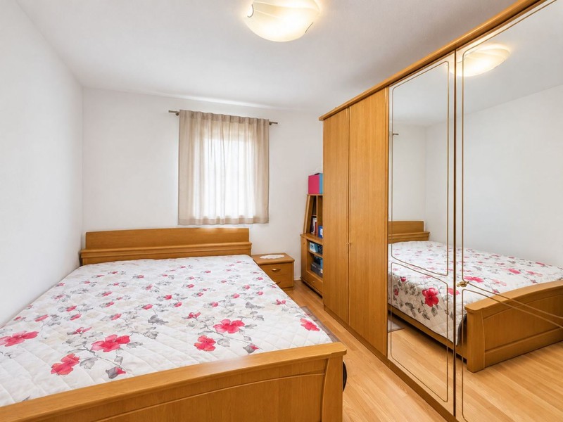 Bedroom with double bed and mirrored wardrobe