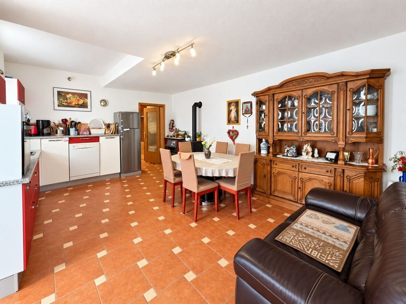 Kitchen with dining area and display cabinet