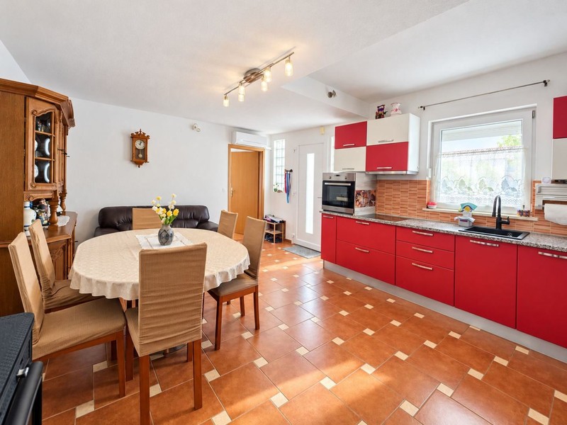 Red kitchen with round dining table