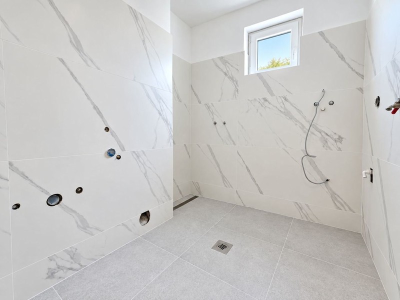 Bathroom with new marble-effect tiles