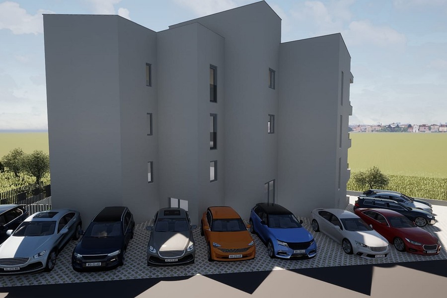 Rear view with outdoor parking spaces