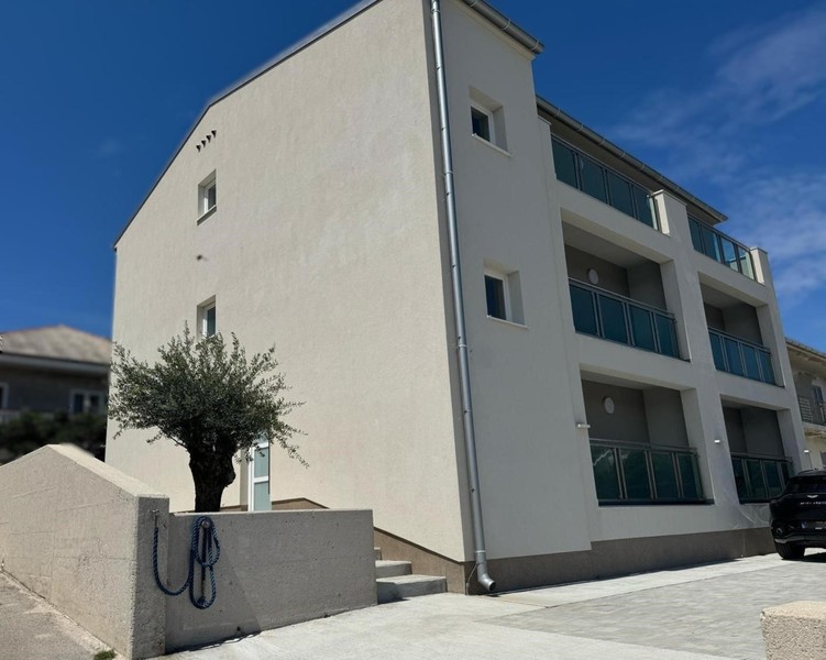New building with five apartments in Pag with balconies and olive tree