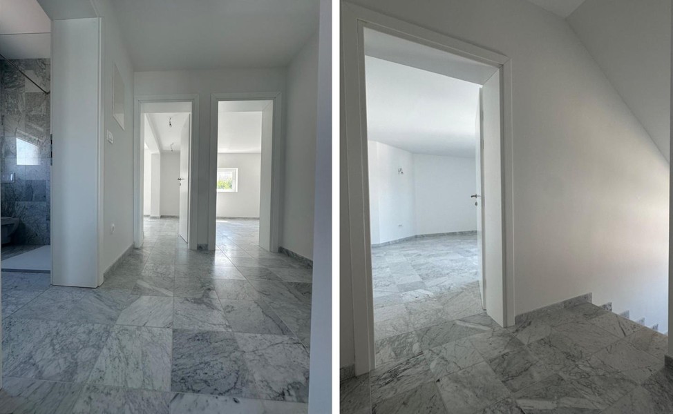 Hallway with marble floor and doors to the rooms