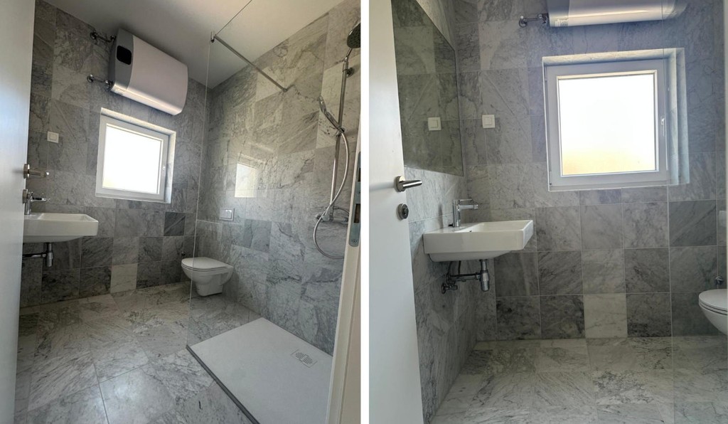 Bathroom with shower, washbasin and toilet