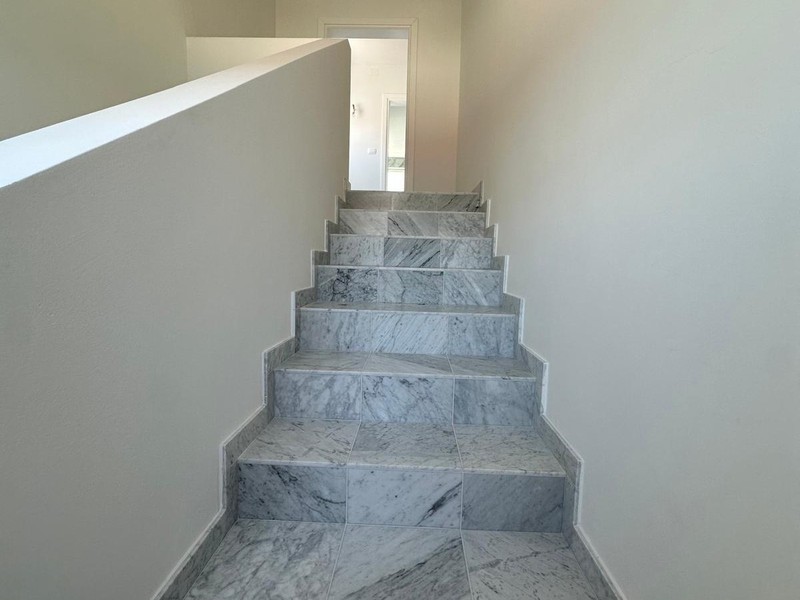 Marble staircase leading to the penthouse