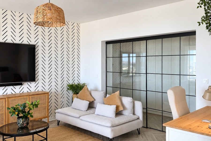 Living room with glass wall to the work area