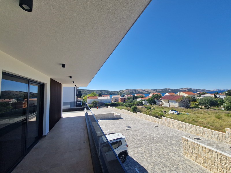 Terrace with view of neighbouring houses and the sea