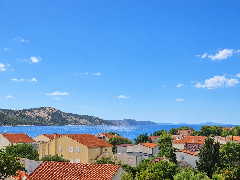 View over the rooftops of Stara Novalja towards the sea
