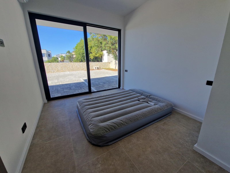 Second bedroom with patio door