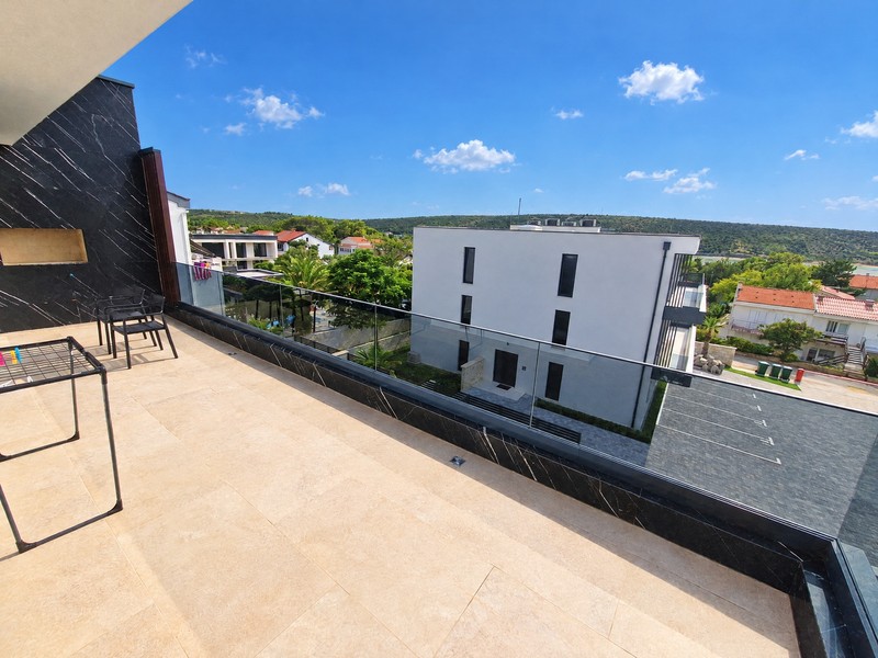 Terrace with a view of the neighbouring building and the bay