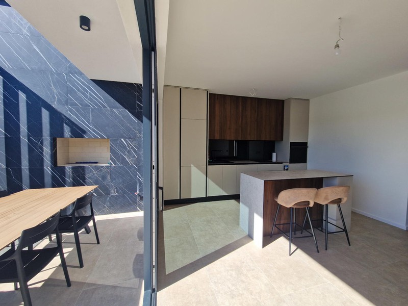 Kitchen with kitchen island and dining area