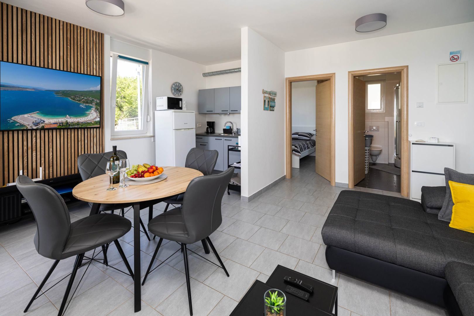Living area with dining table and view to the hallway