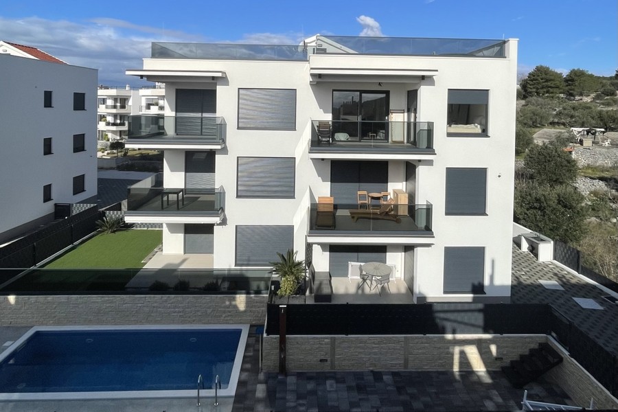 Residential building with balconies and shared pool