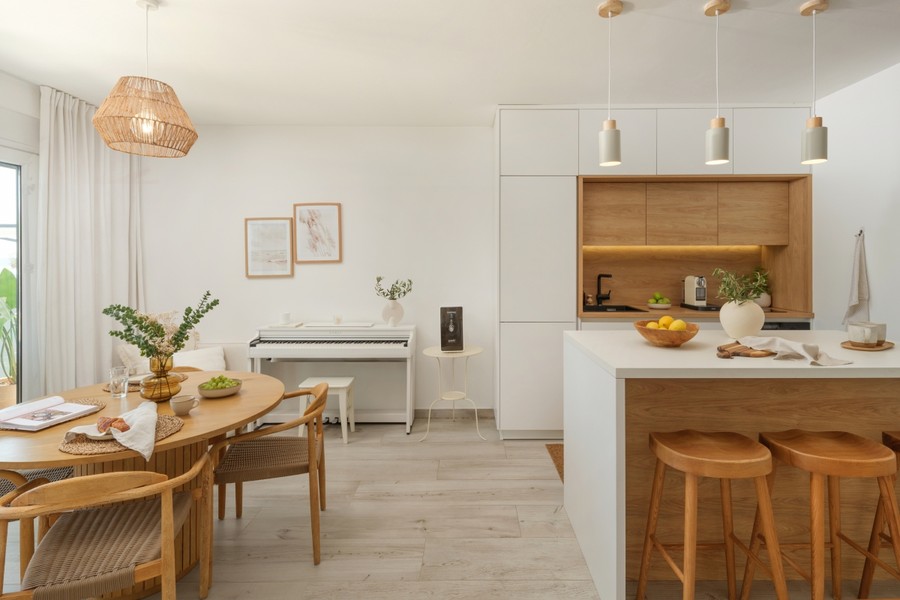 Dining area with wooden table and kitchen island