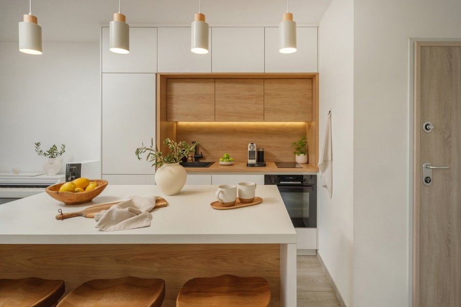 Kitchen island with white and wooden cabinets