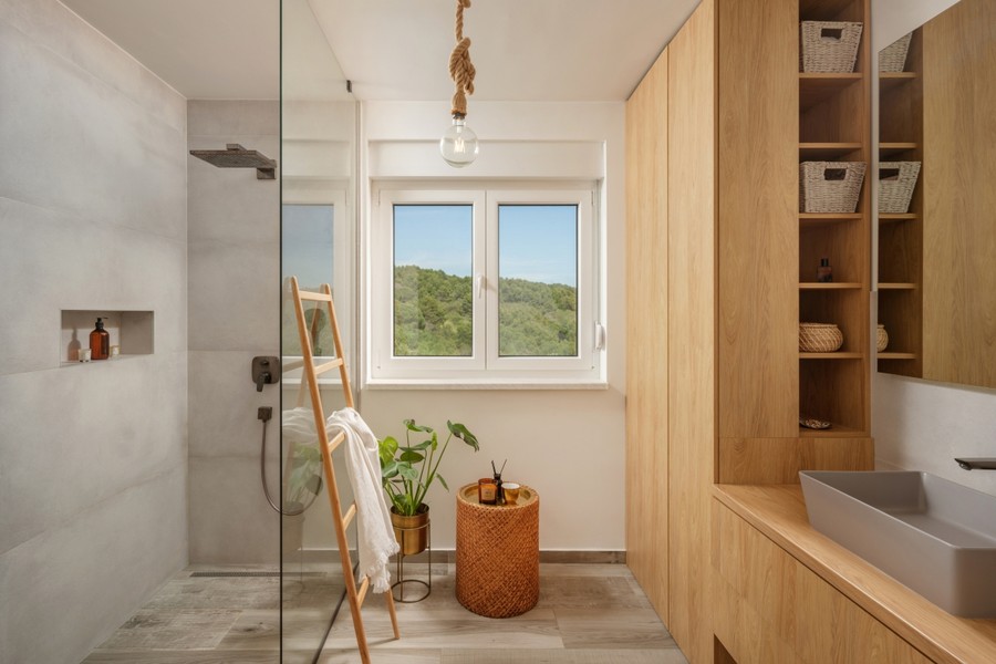 Bathroom with shower and wooden shelf
