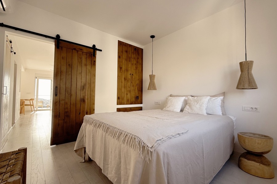 Bedroom with wooden sliding door