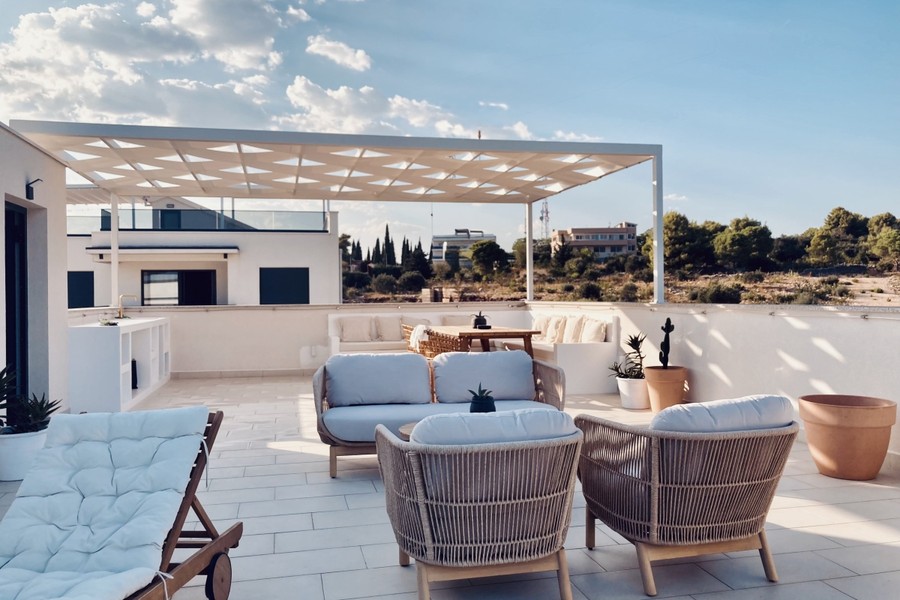 Roof terrace with pergola and seating groups