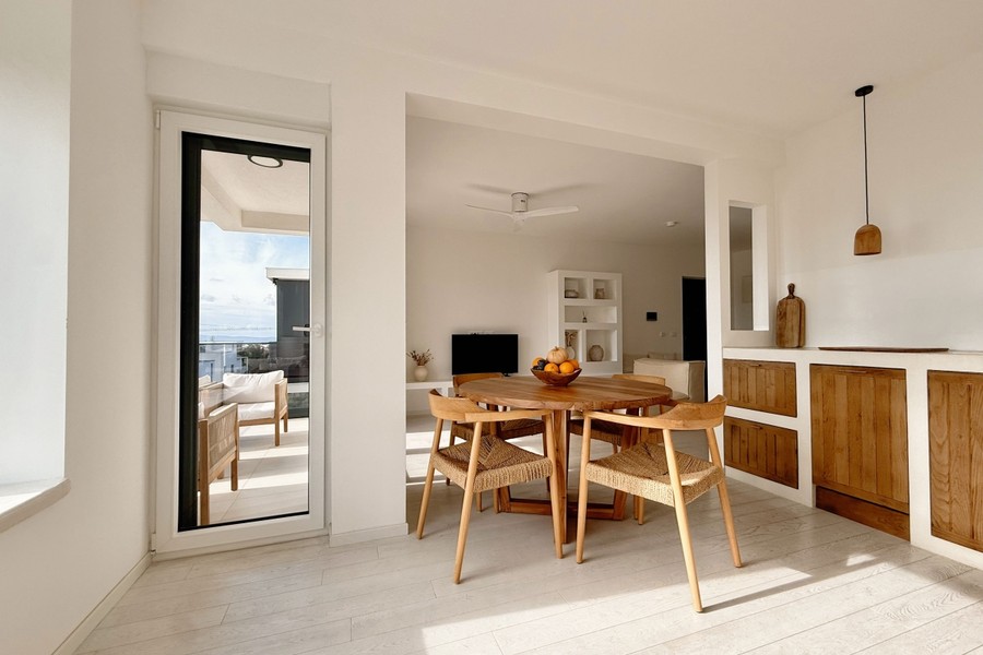 Open-plan living space with round dining table