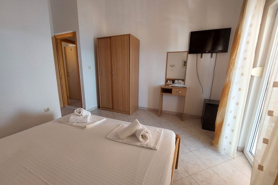 Hotel room with TV and balcony