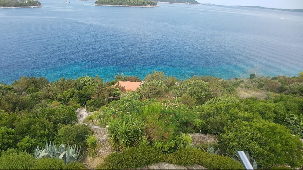 View from the balcony of the garden and the sea - house for sale in Croatia.