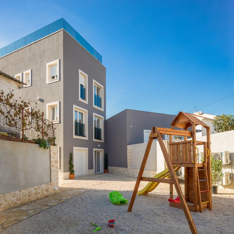 Inner courtyard of villa H1208 - with children's playground.