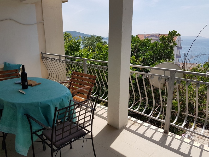 View from a dining area to the bedroom with the balcony
