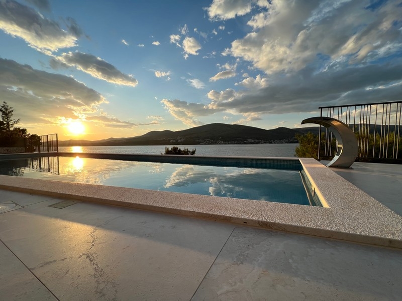 Infinity pool at sunset above the bay