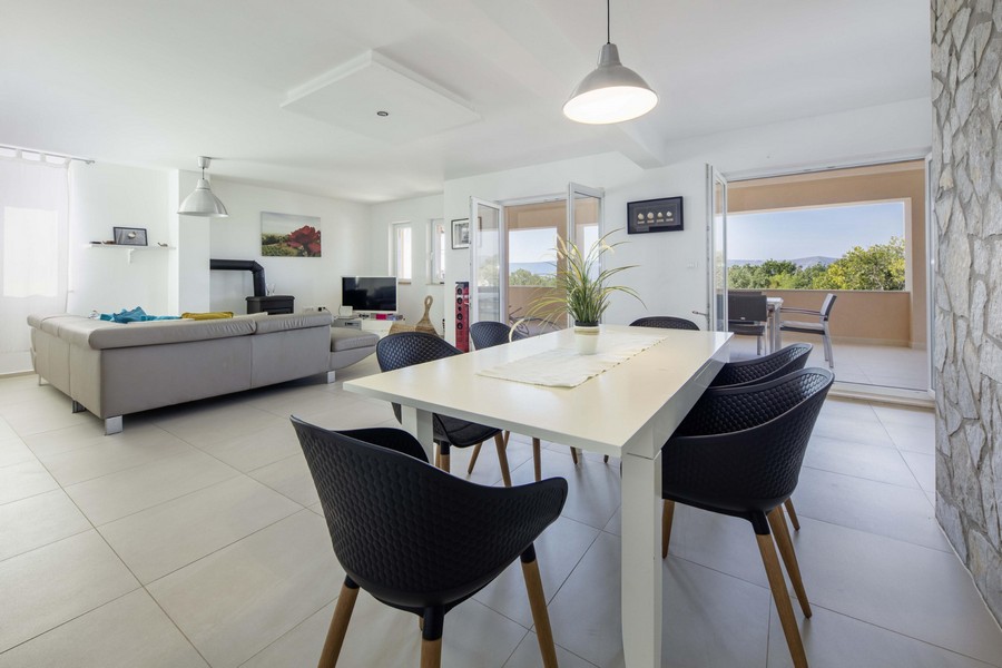 Dining area with white table and black chairs
