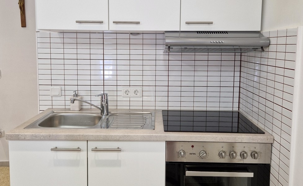 Kitchenette with electrical appliances and storage space