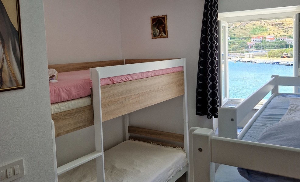 Bedroom with bunk bed and sea view