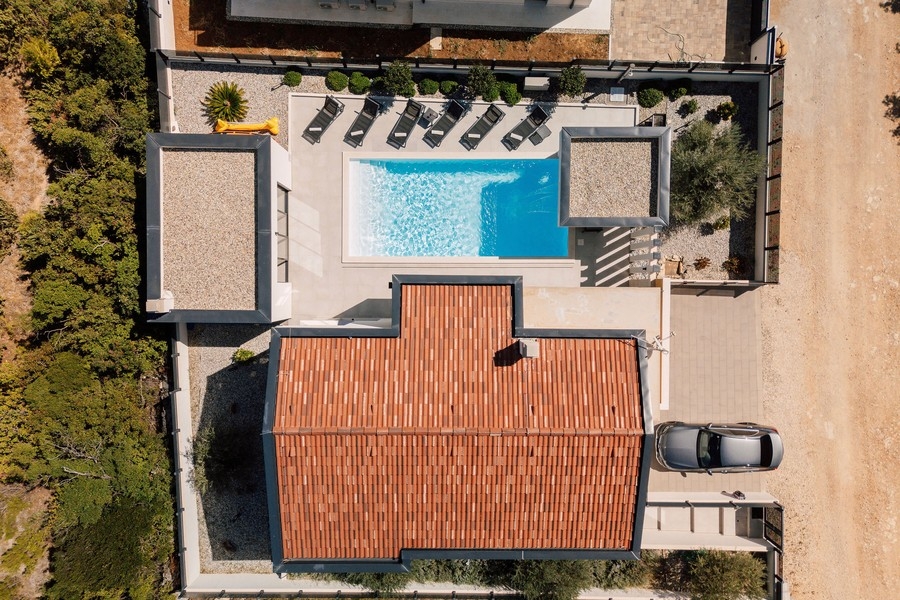Aerial view of house, pool and plot