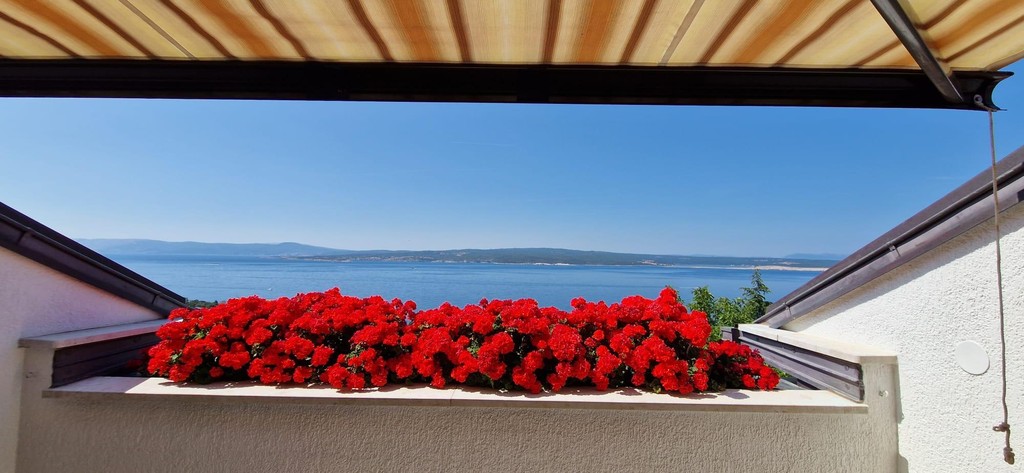 View of the sea from the covered balcony
