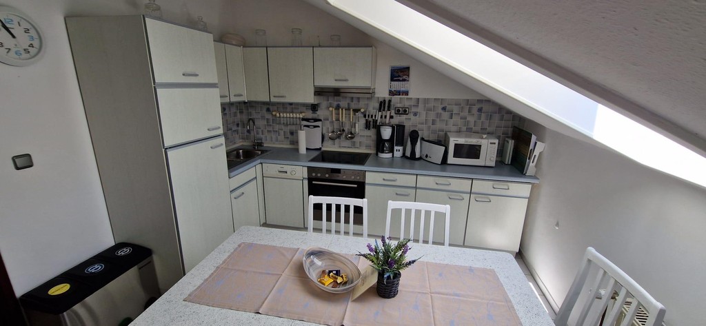 Kitchen with skylight and dining area