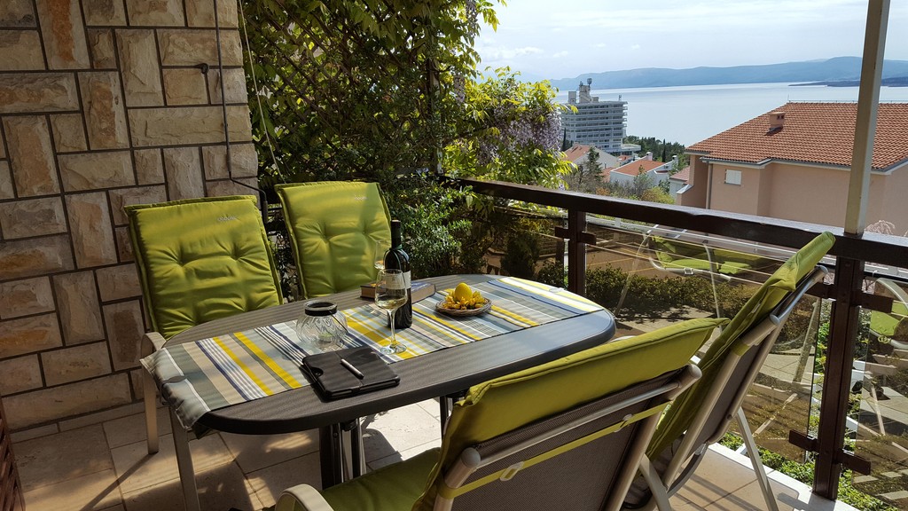 Balcony with seating area and sea view
