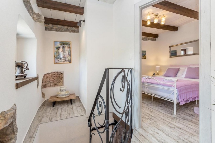 The upper floor with a view into the bedrooms.