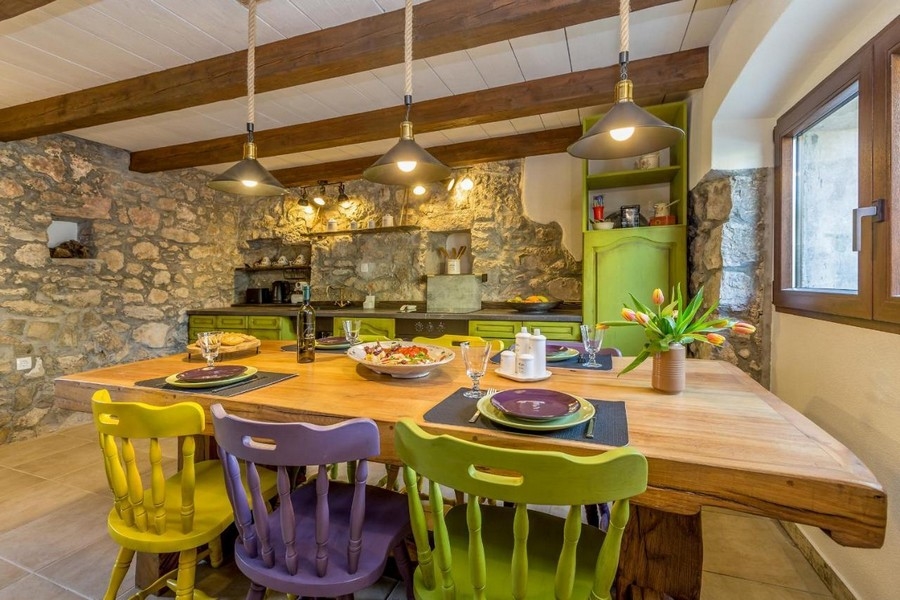 Mediterranean dining area and view of the kitchen in country house style. Panorama Scouting H2661, Croatia.