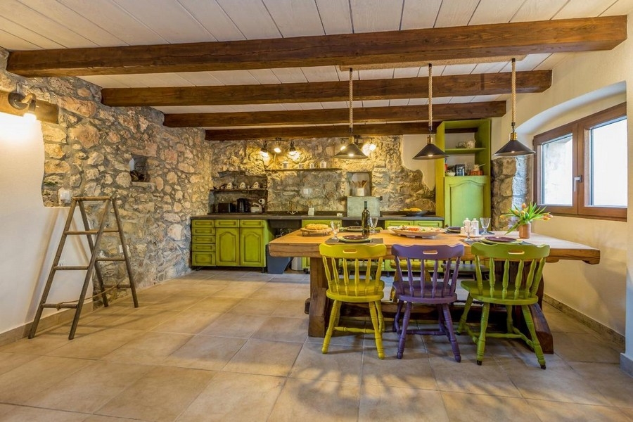 Mediterranean ground floor with rustic elements of the original house.