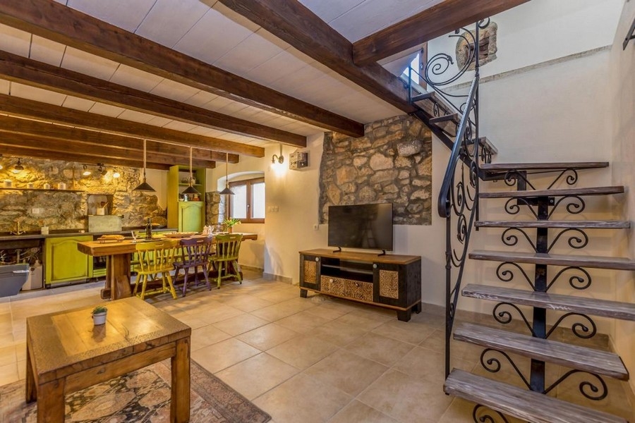 Living area and staircase to the upper floor.