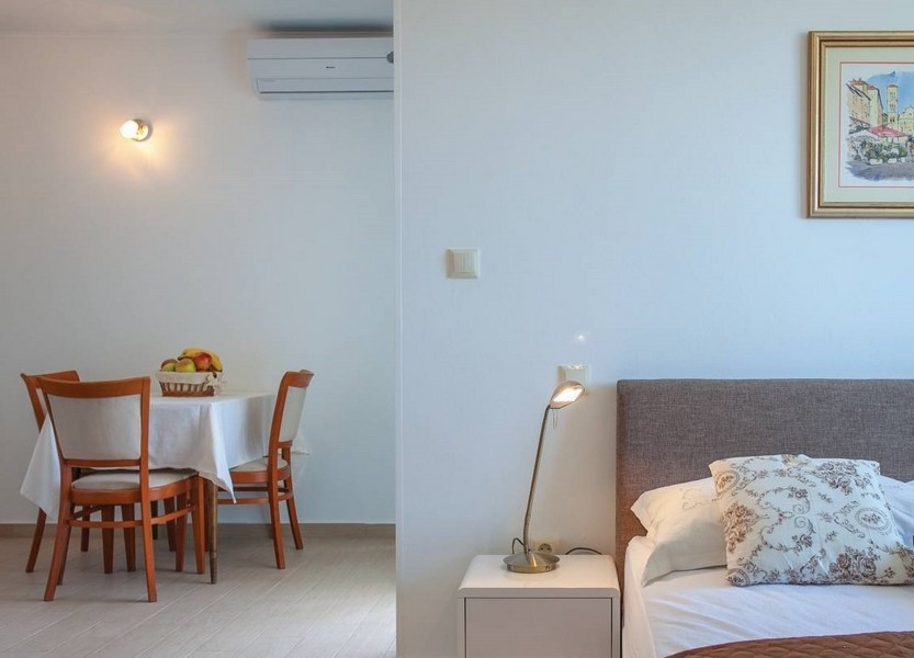 Air-conditioned dining area and view of the bed.