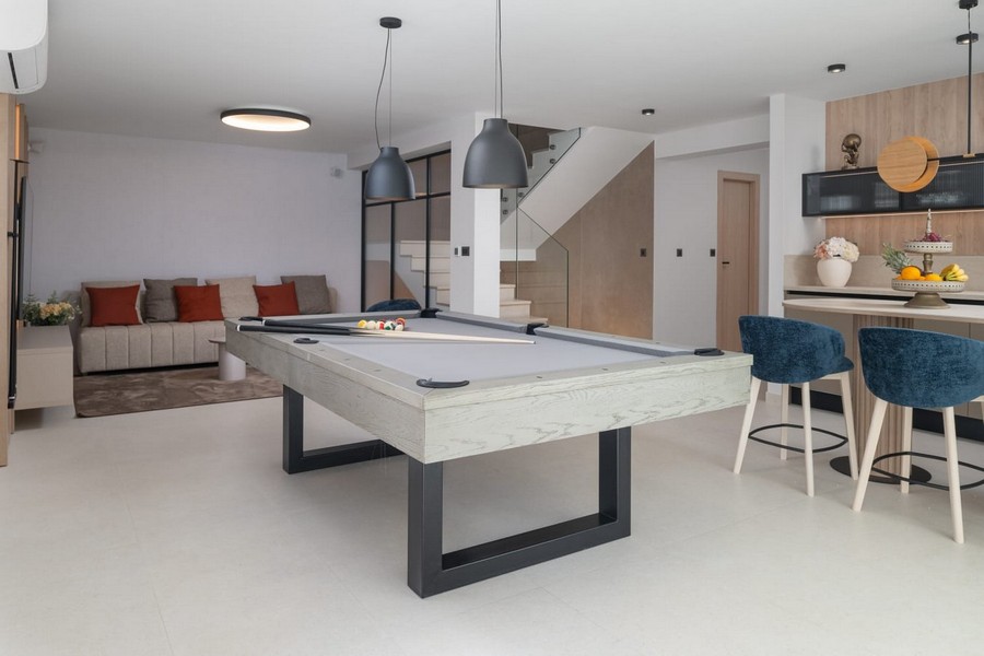 Pool table in the open plan living area of ​​the villa