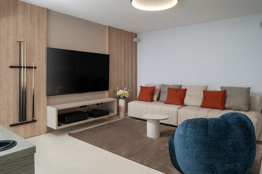 Stylishly furnished living room with TV area