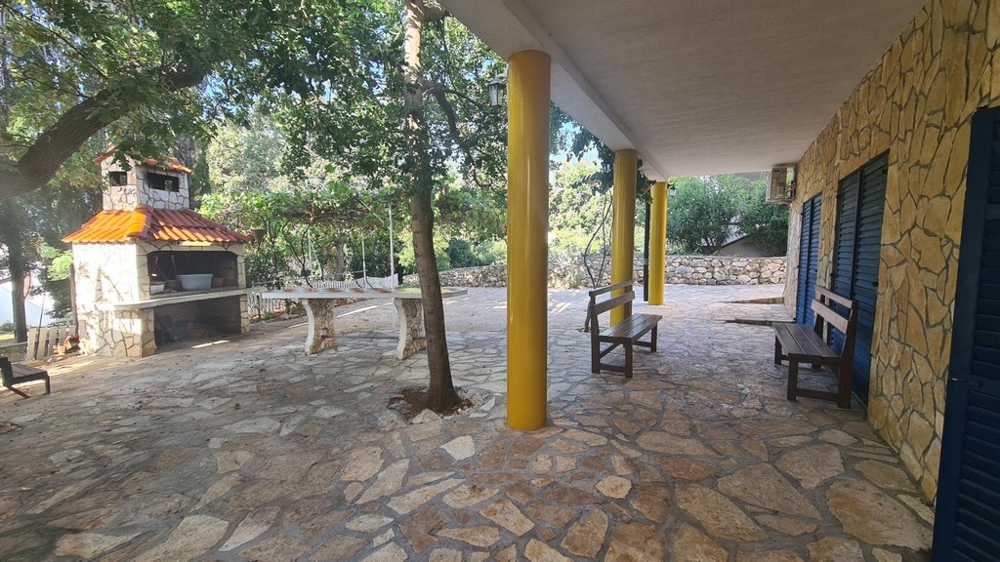Large barbecue in the shady garden