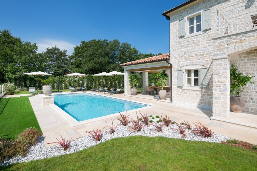 Elegant property in Croatia with swimming pool, well-kept lawn and decorative shrubs