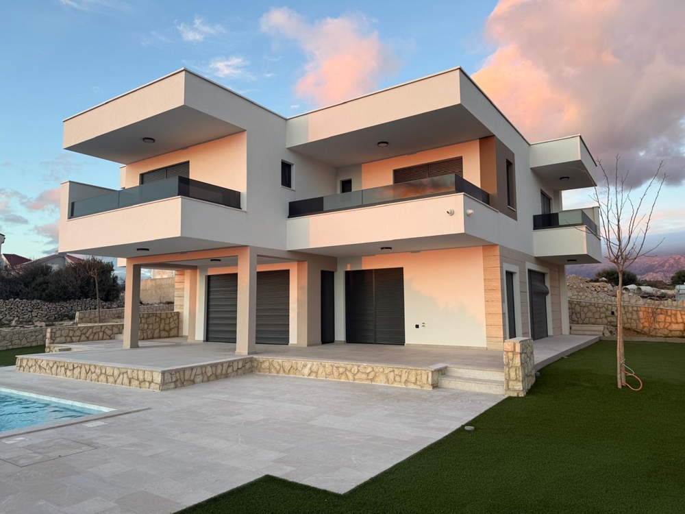 Modern villa with pool for sale in Novalja, Croatia, with outdoor relaxation area